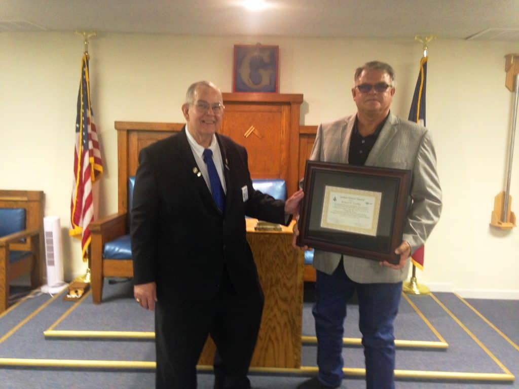 Brother Bob Lindley receiving this year's Golden Trowel Award at Wolfforth-Frenshp Lodge from DDGM at Large Glenn Fant. Also presenting on behalf of Masonic District 93-A was Charles Mire (not pictured)